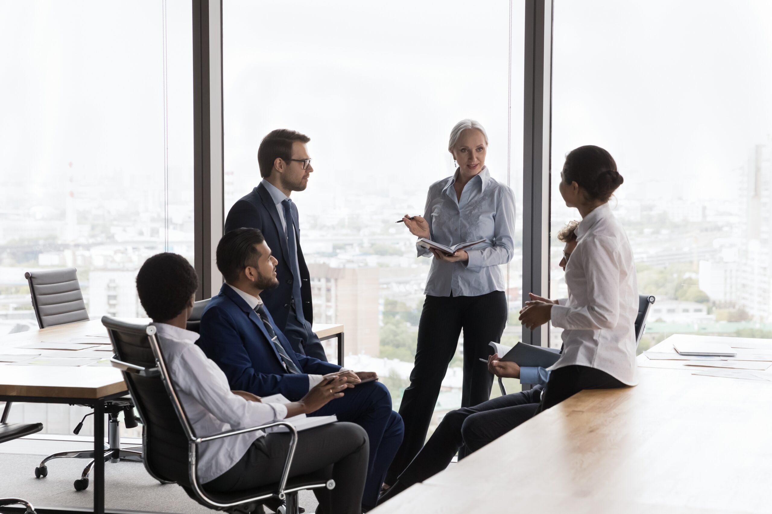 Confident,Mature,Female,Business,Leader,Holding,Meeting,,Training,,Coaching,With Company Alignment